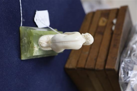 Ferdinand Preiss. An Art Deco carved ivory figure of a crouching female nude, height 5in.